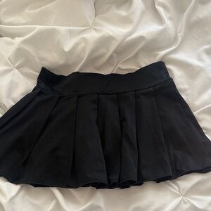 Black pleated mini skirt